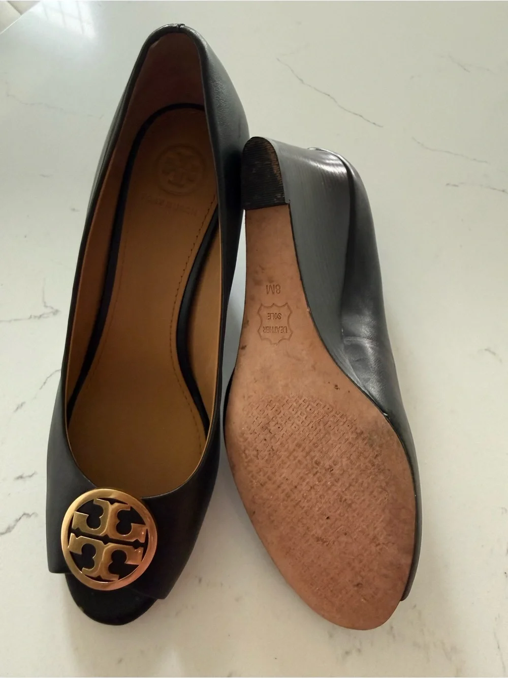 Tory Burch Black Leather Peep-Toe Heels with Gold Logo Medallion